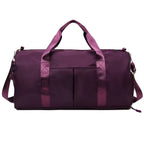 Waterproof gym duffle bag with ventilated shoe compartment and adjustable shoulder strap