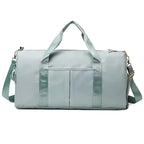 Waterproof gym duffle bag with ventilated shoe compartment and adjustable shoulder strap