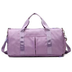 Waterproof gym duffle bag with ventilated shoe compartment and adjustable shoulder strap