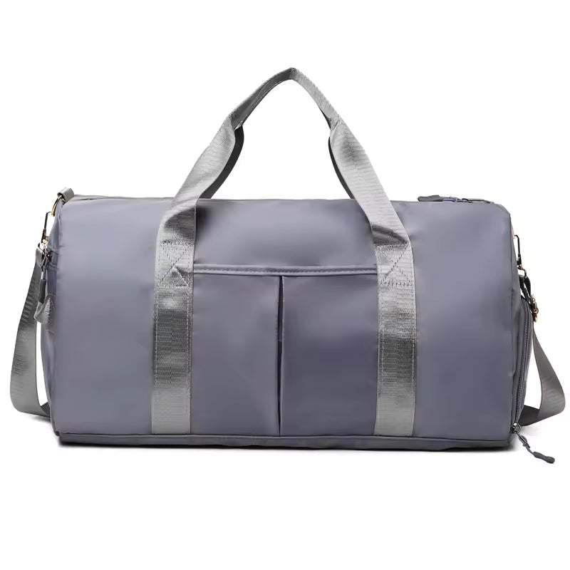 Waterproof gym duffle bag with ventilated shoe compartment and adjustable shoulder strap