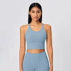 Women's cross-back athletic crop tank top with open back and quick-dry fabric