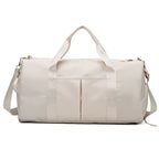 Waterproof gym duffle bag with ventilated shoe compartment and adjustable shoulder strap