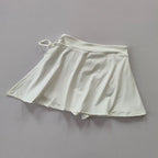 Women's high-waist pleated tennis and padel skirt with built-in compression shorts