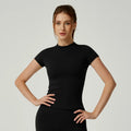 Women's seamless gym crop top with built-in light support bra and removable pads