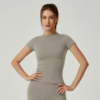 Women's seamless gym crop top with built-in light support bra and removable pads