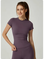Women's seamless gym crop top with built-in light support bra and removable pads