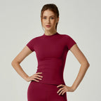 Women's seamless gym crop top with built-in light support bra and removable pads