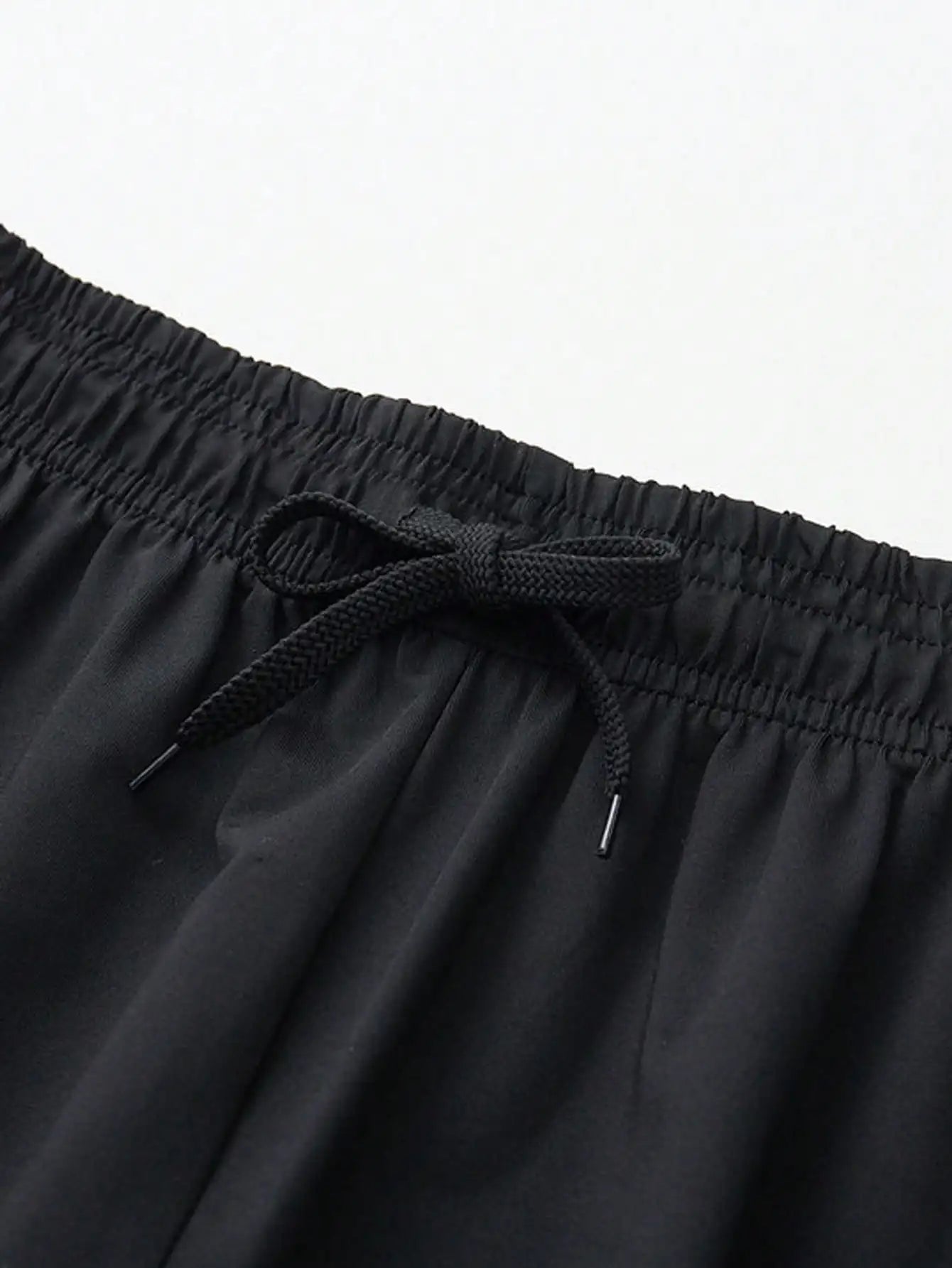 Men's 2-in-1 training pants with built-in compression liner and tapered ankle