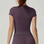 Women's seamless gym crop top with built-in light support bra and removable pads