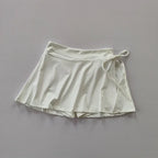 Women's high-waist pleated tennis and padel skirt with built-in compression shorts