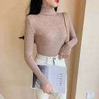 Women's ribbed knit turtleneck sweater, fitted with long sleeves